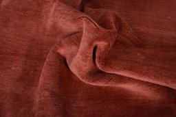 Corner detail of New Persian Gabbeh rug showing border pattern and Wool pile
