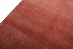Backside of handmade New Persian Gabbeh rug showing knot structure and weave density