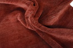 Corner detail of New Persian Gabbeh rug showing border pattern and Wool pile