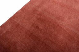 Backside of handmade New Persian Gabbeh rug showing knot structure and weave density
