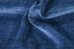 Corner detail of New Persian Gabbeh rug showing border pattern and Wool pile