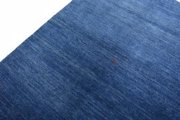 Backside of handmade New Persian Gabbeh rug showing knot structure and weave density