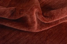 Corner detail of New Persian Gabbeh rug showing border pattern and Wool pile