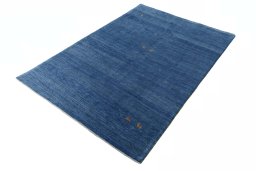 Corner detail of New Persian Gabbeh rug showing border pattern and Wool pile