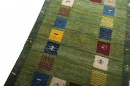 Backside of handmade New Persian Gabbeh rug showing knot structure and weave density