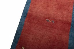 Backside of handmade New Persian Gabbeh rug showing knot structure and weave density