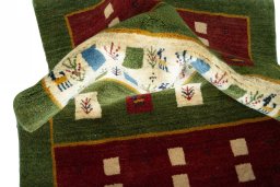 Corner detail of New Persian Gabbeh rug showing border pattern and Wool pile