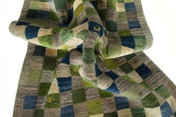 Corner detail of New Persian Gabbeh rug showing border pattern and Wool pile