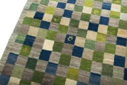 Backside of handmade New Persian Gabbeh rug showing knot structure and weave density