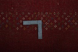 Corner detail of New Persian Gabbeh rug showing border pattern and Wool pile