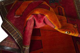 Corner detail of 2000s Persian Gabbeh rug showing border pattern and Wool pile