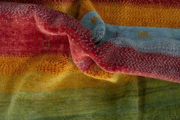 Corner detail of New Persian Gabbeh rug showing border pattern and Wool pile