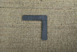 Corner detail of New Persian Gabbeh rug showing border pattern and Wool pile