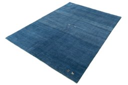 Corner detail of New Persian Gabbeh rug showing border pattern and Wool pile