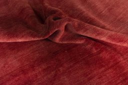 Corner detail of New Persian Gabbeh rug showing border pattern and Wool pile