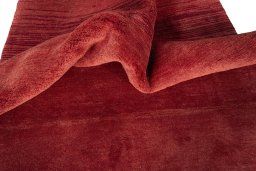 Corner detail of New Persian Gabbeh rug showing border pattern and Wool pile