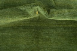 Corner detail of New Persian Gabbeh rug showing border pattern and Wool pile