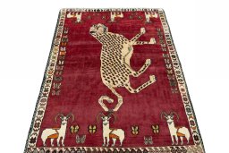 Surface texture of 2000s Persian Gabbeh rug with natural Wool and intricate pattern