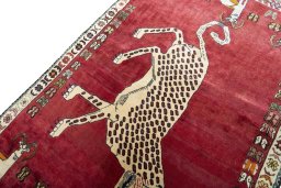 Backside of handmade 2000s Persian Gabbeh rug showing knot structure and weave density