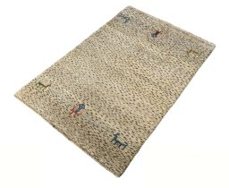 Corner detail of 2000s Persian Gabbeh rug showing border pattern and Wool pile