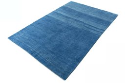 Corner detail of New Persian Gabbeh rug showing border pattern and Wool pile