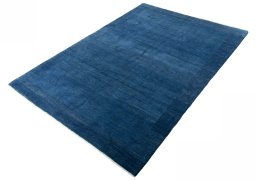Corner detail of New Persian Gabbeh rug showing border pattern and Wool pile