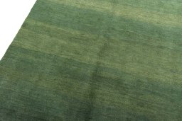 Backside of handmade New Persian Gabbeh rug showing knot structure and weave density