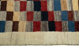 Close-up detail of 2000s Persian Gabbeh rug from Iran / Persia showing Wool weave
