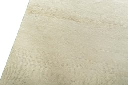 Backside of handmade New Persian Gabbeh rug showing knot structure and weave density