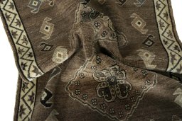 Corner detail of 2000s Persian Gabbeh rug showing border pattern and Wool pile