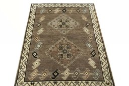 Surface texture of 2000s Persian Gabbeh rug with natural Wool and intricate pattern