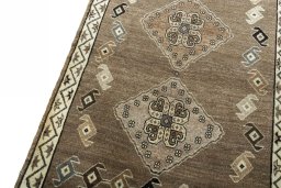 Backside of handmade 2000s Persian Gabbeh rug showing knot structure and weave density