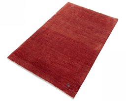 Corner detail of New Persian Gabbeh rug showing border pattern and Wool pile