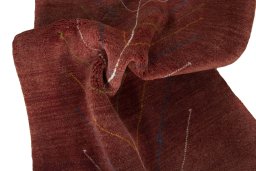 Corner detail of New Persian Gabbeh rug showing border pattern and Wool pile