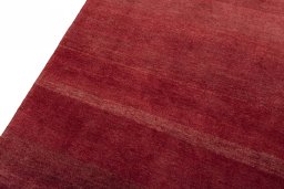 Backside of handmade New Persian Gabbeh rug showing knot structure and weave density
