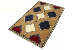 Corner detail of 2000s Persian Gabbeh rug showing border pattern and Wool pile