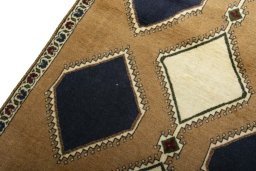 Backside of handmade 2000s Persian Gabbeh rug showing knot structure and weave density