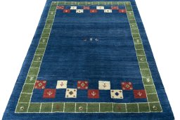 Surface texture of New Persian Gabbeh rug with natural Wool and intricate pattern