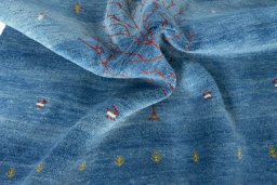 Corner detail of New Persian Gabbeh rug showing border pattern and Wool pile