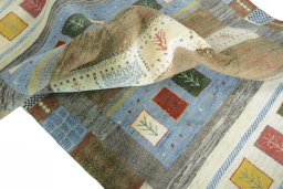 Corner detail of New Persian Gabbeh rug showing border pattern and Wool pile