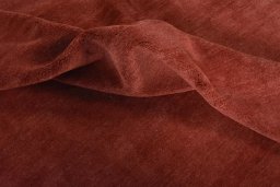 Corner detail of New Persian Gabbeh rug showing border pattern and Wool pile