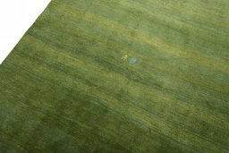 Backside of handmade New Persian Gabbeh rug showing knot structure and weave density
