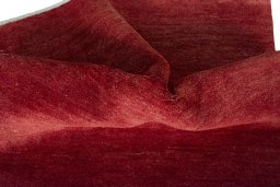 Corner detail of New Persian Gabbeh rug showing border pattern and Wool pile