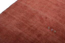 Backside of handmade New Persian Gabbeh rug showing knot structure and weave density
