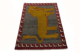 Surface texture of 2000s Persian Gabbeh rug with natural Wool and intricate pattern
