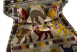 Corner detail of 2000s Persian Gabbeh rug showing border pattern and Wool pile