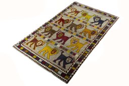 Corner detail of 2000s Persian Gabbeh rug showing border pattern and Wool pile