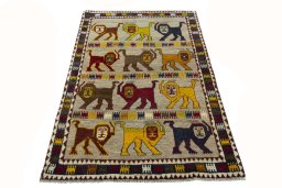 Surface texture of 2000s Persian Gabbeh rug with natural Wool and intricate pattern