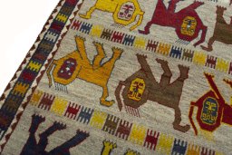 Backside of handmade 2000s Persian Gabbeh rug showing knot structure and weave density