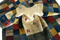 Corner detail of New Persian Gabbeh rug showing border pattern and Wool pile